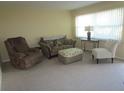 Living room with seating area and large window at 5876 21St N St # 3, St Petersburg, FL 33714
