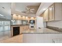 Bright kitchen with white appliances and granite countertops at 9214 Golf View Dr, New Port Richey, FL 34655