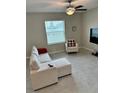 Living room with sectional sofa and tile floors at 13621 Willow Bluestar Loop, Riverview, FL 33579
