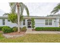 Back exterior view, screened-in porch, landscaping at 2438 Sifield Greens Way # 44, Sun City Center, FL 33573