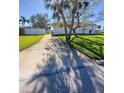 Landscaped side yard with a long driveway at 289 Monte Cristo Blvd, St Petersburg, FL 33715