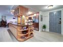 Modern kitchen with island, stainless steel appliances, and light wood cabinets at 36750 Us Highway 19 N # 20-205, Palm Harbor, FL 34684