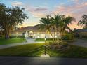 Stunning home with palm trees and circular driveway at 4098 Las Palmas Way, Sarasota, FL 34238