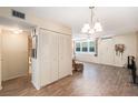 Living room with laminate flooring, and neutral walls at 4880 Locust Ne St # 227, St Petersburg, FL 33703
