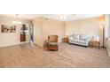 Living room with laminate wood flooring and neutral decor at 4880 Locust Ne St # 227, St Petersburg, FL 33703
