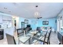 Bright dining area with glass table and seating for six at 5176 Se Salmon Se Dr # D, St Petersburg, FL 33705