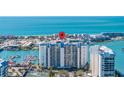 Aerial view showcasing condo building and water access at 9525 Blind Pass Rd # 507, St Pete Beach, FL 33706