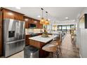 Modern kitchen with stainless steel appliances and island at 9525 Blind Pass Rd # 507, St Pete Beach, FL 33706