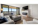 Spacious living room with fireplace and water views at 9525 Blind Pass Rd # 507, St Pete Beach, FL 33706