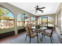 Relaxing screened porch with patio furniture and view of the backyard at 9649 Wilsky Blvd # 3, Tampa, FL 33615
