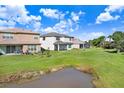 Houses with backyard views overlooking a pond at 3278 Woodland Brook Way, Wesley Chapel, FL 33543