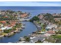 Aerial view of waterfront homes and a bridge at 4687 Alisa Ne Cir, St Petersburg, FL 33703