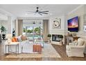 Spacious living room with fireplace, large TV, and comfy seating at 4687 Alisa Ne Cir, St Petersburg, FL 33703