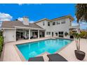 Inviting pool area with patio and lounge chairs at 4687 Alisa Ne Cir, St Petersburg, FL 33703