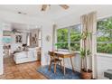 Bright and airy sunroom with a workspace, offering views of the backyard at 5107 27Th S Ave, Gulfport, FL 33707