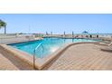 Inviting community pool area with oceanfront views at 5396 Gulf Blvd # 605, St Pete Beach, FL 33706