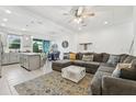 Bright living space with a large sectional, modern decor, and open to the dining area at 6324 Camino Dr, Apollo Beach, FL 33572