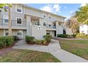 Building exterior during the day, showing multiple units and landscaping at 7240 E Bank Dr # 204, Tampa, FL 33617