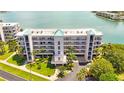 Aerial view of a beautiful waterfront condo building at 8001 Sailboat Key S Blvd # 202, St Pete Beach, FL 33707