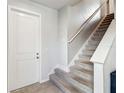 Gray carpeted stairs leading to the second floor at 10711 Old Sycamore Loop, Land O Lakes, FL 34638