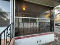 Screened porch with ornate railing and wood ceiling at 1308 E Caracas St, Tampa, FL 33603
