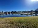 Scenic view of a lake in a residential community at 15731 Crystal Waters Dr, Wimauma, FL 33598