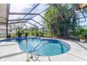 Relaxing kidney-shaped pool with a screened enclosure and spa at 2109 Elmwood Ct, Plant City, FL 33563