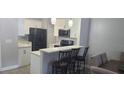 Modern kitchen featuring white cabinets, quartz countertops and stainless steel appliances at 3611 19Th N St, St Petersburg, FL 33713