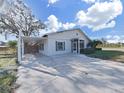 Front view of a single story home with carport at 4302 W Iowa Ave, Tampa, FL 33616