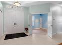 Bright and airy entryway with tile flooring and access to other rooms at 456 Diamond Dr, Spring Hill, FL 34609