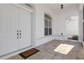 Inviting front entrance with double doors and a tiled porch at 456 Diamond Dr, Spring Hill, FL 34609