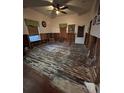 Large living room with exposed hardwood floors at 503 W Renfro St, Plant City, FL 33563