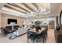 Spacious living room with high ceilings, modern chandelier, and open floor plan at 6136 Jensen View Ave, Apollo Beach, FL 33572