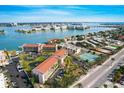 Aerial view of Bridge Hampton Bay, highlighting its waterfront location and amenities at 8711 Blind Pass Rd # 307A, St Pete Beach, FL 33706