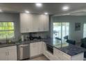 Modern kitchen featuring granite countertops and stainless steel appliances at 8818 Bay Pointe Dr # 208, Tampa, FL 33615