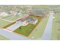 House with a large backyard and a two-car garage, seen from above at 13254 Kitty Rd, Weeki Wachee, FL 34614