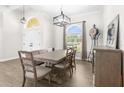 Formal dining room with a large wooden table and bench seating at 13254 Kitty Rd, Weeki Wachee, FL 34614