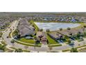 Community overview showcasing a lakefront neighborhood with numerous homes at 16340 Treasure Point Dr, Wimauma, FL 33598