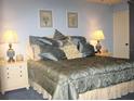 Main bedroom with a king-size bed and elegant decor at 20040 Gulf Blvd # 302, Indian Shores, FL 33785
