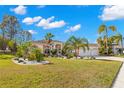 Single story house with palm trees and a two-car garage at 3702 Gaviota Dr, Ruskin, FL 33573