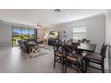 Spacious living room with a sectional sofa, large TV, and dining area at 5211 Marina Basin Ct, Bradenton, FL 34211