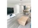 Open floor plan with kitchen and living area, featuring modern decor at 690 Fox St, Longboat Key, FL 34228
