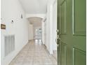 Bright and spacious entryway with tile flooring and access to other rooms at 8529 Alexandra Arbor Ln, Temple Terrace, FL 33637