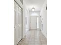 Clean and airy entryway with tile floors and ample closet space at 8529 Alexandra Arbor Ln, Temple Terrace, FL 33637