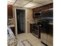 Stainless steel appliances and tile floor in kitchen at 901 8Th Sw St, Ruskin, FL 33570
