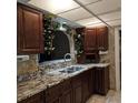 Kitchen with granite countertops and dark wood cabinets at 901 8Th Sw St, Ruskin, FL 33570