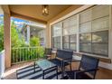 Relaxing front porch with seating and a striped rug at 10814 Newbridge Dr, Riverview, FL 33579