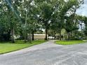 Brick driveway leading to a large home with lush landscaping at 11554 Monette Rd, Riverview, FL 33569