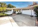 Spacious driveway with a large garage and basketball hoop at 121 Live Oak Ln, Largo, FL 33770