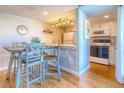 Bright, updated kitchen with white cabinets and granite countertops at 175 Medallion Blvd # F, Madeira Beach, FL 33708